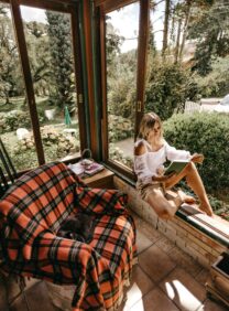 Bookfluencer reading in scenic location